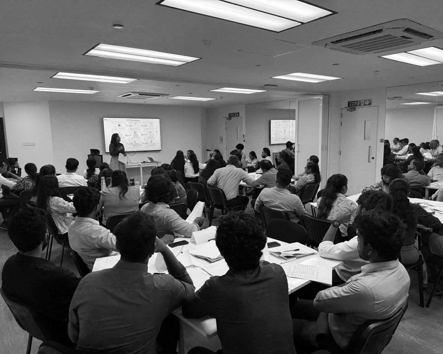 A full room of participants during the PTP workflow session